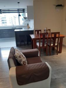 a living room with a couch and a table at EDIFICIO Samsara in Quito