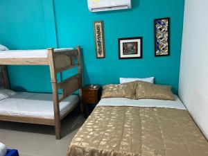 Giường trong phòng chung tại Cabaña San Jose Beach