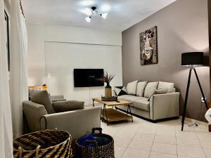 TV a/nebo společenská místnost v ubytování IONIAN SUITES by Bruskos