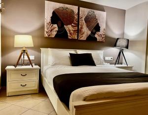 Postel nebo postele na pokoji v ubytování IONIAN SUITES by Bruskos