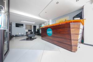 an office with a lobby with a reception desk at Ayenda Vittapark in Medellín