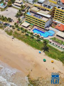 an aerial view of a beach with a hotel at Brisas de Tabatinga Flat in Conde