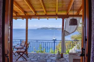 a view of the ocean from the porch of a house at Sea Frame in Skiathos