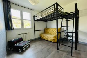 a bedroom with a bunk bed and a couch at Bright 50 M With Balcony And View On The Valley in Briançon