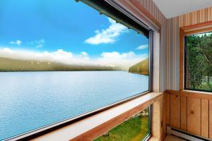 a window in a room with a view of a lake at The Treehouse in Joseph