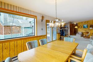 a dining room with a wooden table and chairs at The Treehouse in Joseph