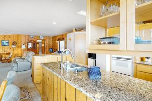 a kitchen with a sink and a counter top at The Treehouse in Joseph