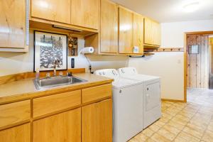a kitchen with a sink and a dishwasher at The Treehouse in Joseph