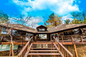 a house with stairs leading to the front of it at The Treehouse in Joseph