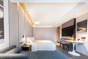 Ліжко або ліжка в номері Atour Hotel Anqing Wuyue Plaza