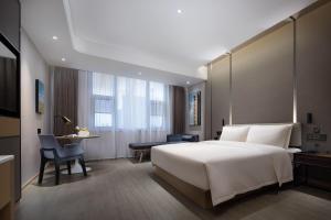Postel nebo postele na pokoji v ubytování Atour Hotel Changsha Wangcheng District