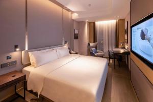 Postel nebo postele na pokoji v ubytování Atour Hotel Huizhou Zhongkai Tianyi