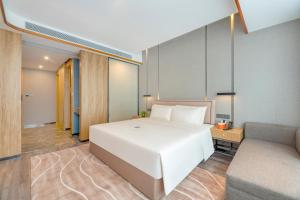 Ένα ή περισσότερα κρεβάτια σε δωμάτιο στο Atour X Hotel Xian Administration Center of North Railway Station