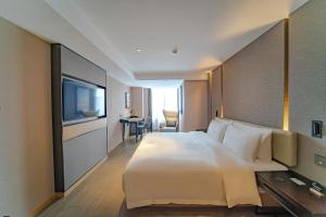 Телевізор і / або розважальний центр в Atour Hotel Hefei USTC Huangshan Road