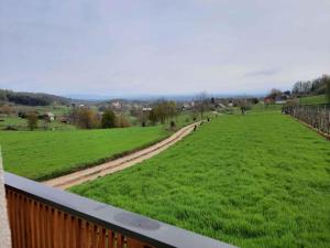 a view of a green field from a balcony at Holiday home in Semic Kranjska Krain 42896 in Semič