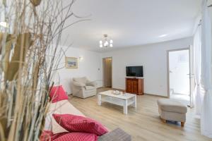 a living room with a couch and a table at Casa Lanamaria in Novi Vinodolski