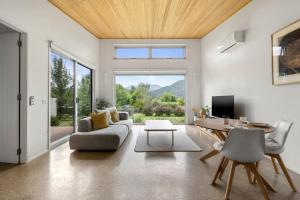 a living room with a couch and a table at Aalborg Bright in Bright