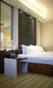 Postel nebo postele na pokoji v ubytování Ixora Hotel Penang