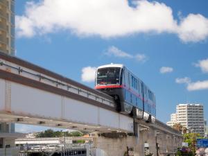 a train on a bridge in a city at Hotel Royal Orion in Naha