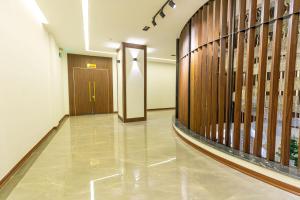 a hallway of a building with a door at Viktor Legends Hotel in Móng Cái +23 photos