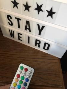 a remote control in front of a sign with the words stay motivated at The RustyCorner- zuhause in Solingen in Solingen