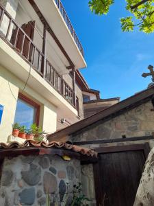 a house with some plants on top of it at Къща за гости Кая in Sozopol