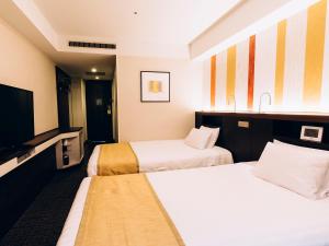 Postel nebo postele na pokoji v ubytování Shinagawa Tobu Hotel