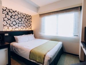 Postel nebo postele na pokoji v ubytování Shinagawa Tobu Hotel