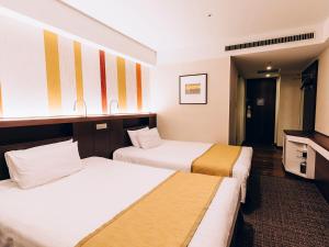 Postel nebo postele na pokoji v ubytování Shinagawa Tobu Hotel