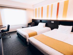 Postel nebo postele na pokoji v ubytování Shinagawa Tobu Hotel