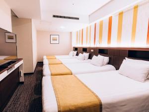 Postel nebo postele na pokoji v ubytování Shinagawa Tobu Hotel