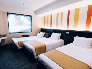 Postel nebo postele na pokoji v ubytování Shinagawa Tobu Hotel