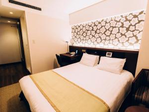 Postel nebo postele na pokoji v ubytování Shinagawa Tobu Hotel