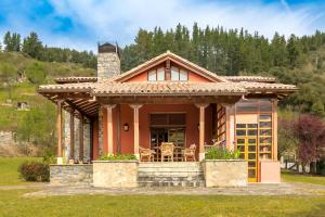 a small house with a porch and a chimney at Exclusivo Chalet en Potes in Potes
