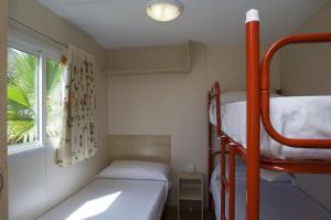 Postel nebo postele na pokoji v ubytování Camping La Aldea