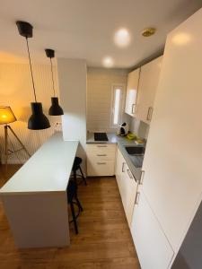 Kuchyň nebo kuchyňský kout v ubytování Harmony Apartments