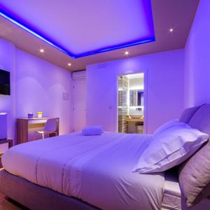 Cama ou camas em um quarto em Aminta - Rooms & Wellness