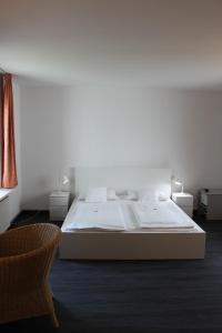 Voodi või voodid majutusasutuse Hotel Am Römerwall toas