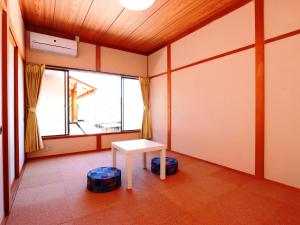 Guesthouse YadoyaDOYA客房内的一张或多张床位