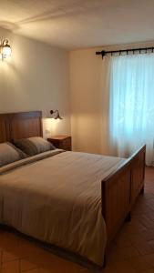 Postel nebo postele na pokoji v ubytování LA CA' DEI COMARI - Locanda da Tullio