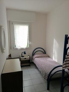 Ein Bett oder Betten in einem Zimmer der Unterkunft Condominio Rosa