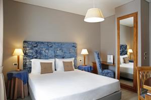 Voodi või voodid majutusasutuse BeYou Hotel Ponte Milvio toas