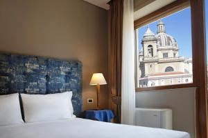 Voodi või voodid majutusasutuse BeYou Hotel Ponte Milvio toas