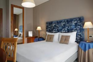 Voodi või voodid majutusasutuse BeYou Hotel Ponte Milvio toas