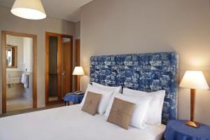 Voodi või voodid majutusasutuse BeYou Hotel Ponte Milvio toas