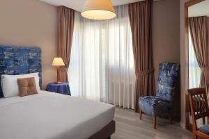 Voodi või voodid majutusasutuse BeYou Hotel Ponte Milvio toas