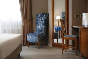 Voodi või voodid majutusasutuse BeYou Hotel Ponte Milvio toas