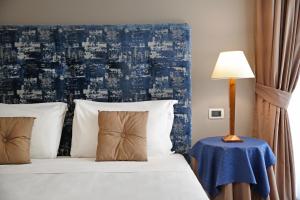 Voodi või voodid majutusasutuse BeYou Hotel Ponte Milvio toas