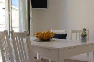 A television and/or entertainment centre at Casa Vacanze Terramare, 550 mt from the beach, close to Ortigia historic center