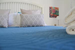 A bed or beds in a room at Casa Vacanze Terramare, 550 mt from the beach, close to Ortigia historic center